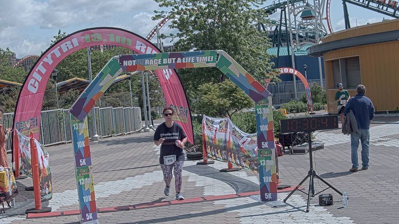 Running image for nancy balaban in brooklyn beach half marathon 10k 5k 2023 june 04